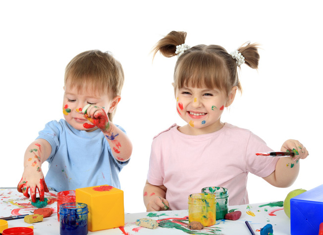 picture of two very young children playing with paints